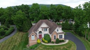 A photo taken from a drone in State College shows the width of Nittany Mountain in the background. 